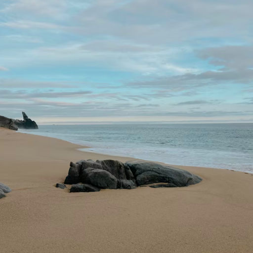 Tranquil beach scene in Cabo with turquoise water and light sand